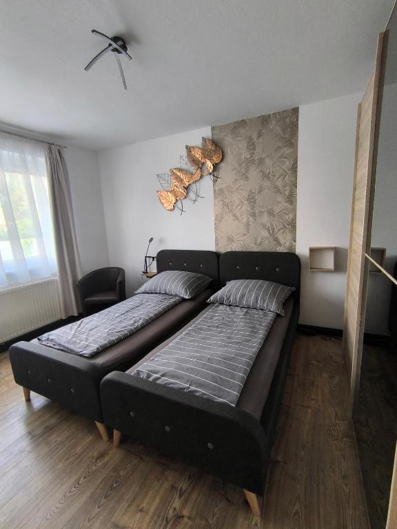 a bedroom with a large bed in a room at 4 You Apartment in Leoben mit Balkon, Garten und kostenlosen Parkplatz in Leoben