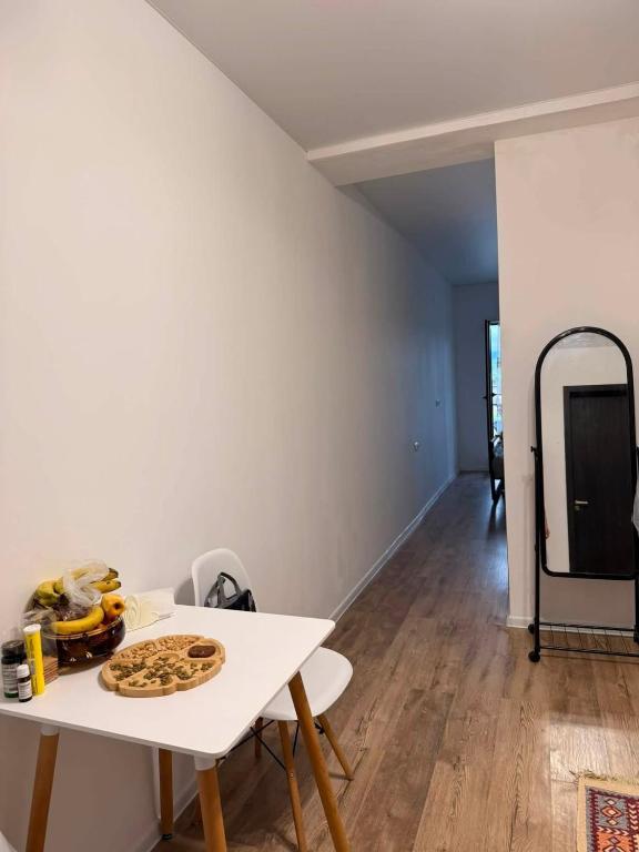 a room with a white table with food on it at Bazaleti Lake Escape in Bazalet'i