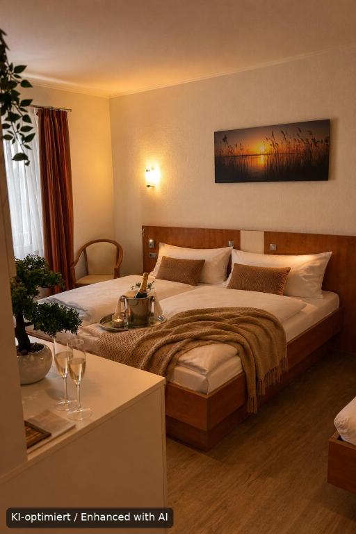 a hotel room with a bed and a table at Hotel Falk in Bremen