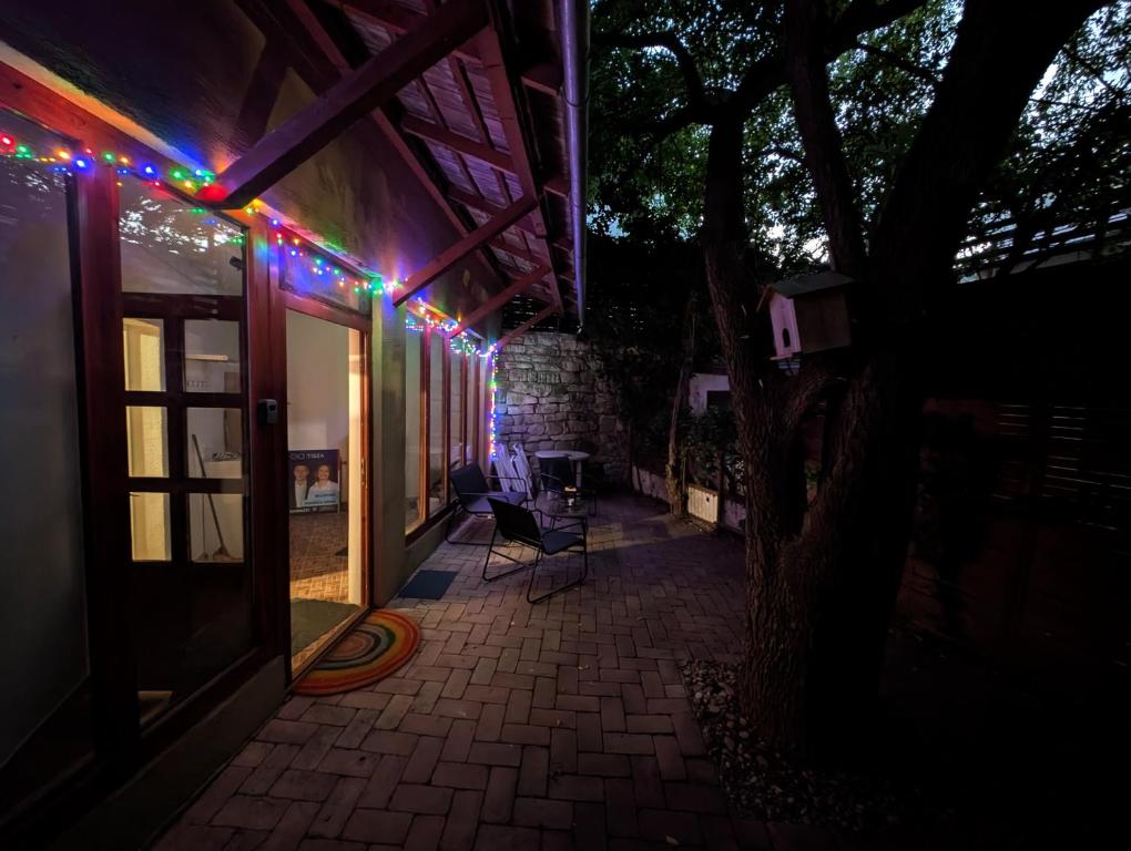 a patio with christmas lights on the side of a house at B59 mini in Budakalász