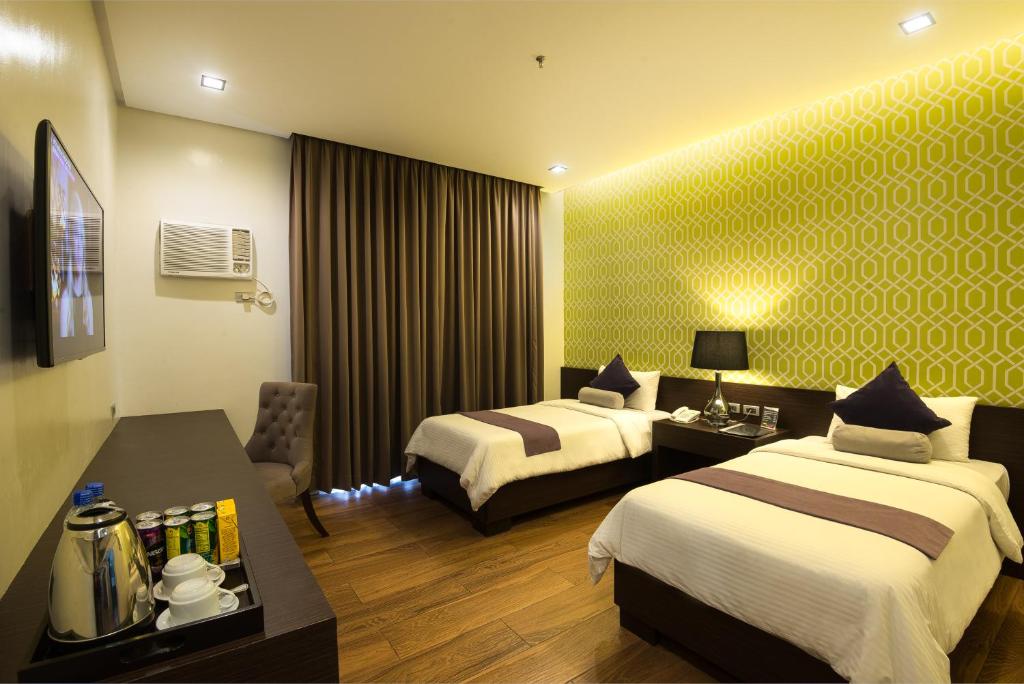 Postel nebo postele na pokoji v ubytování Lenox Hotel
