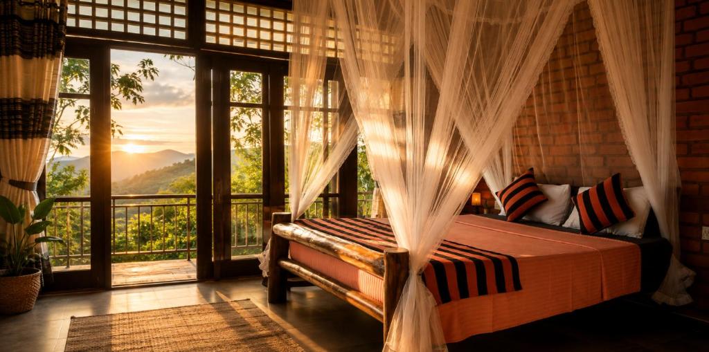 a bedroom with a bed and a large window at Apurvi Homestay in Ella