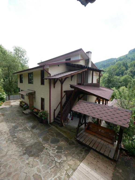 a house with a bench in front of it at KarpatskeDzerelo in Roztoky