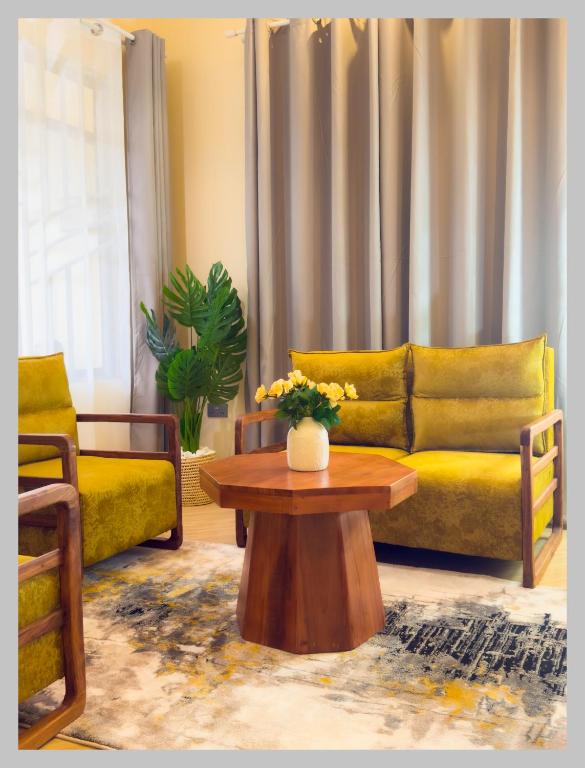 a living room with a couch and a coffee table at HM Homes in Morogoro