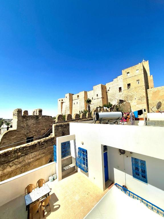 a view of a castle from the balcony of a house at Dar Aziz VIP in Sousse