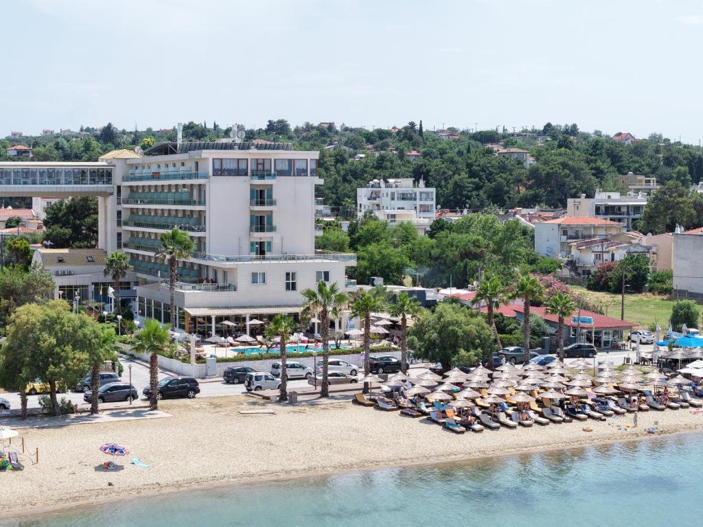 an aerial view of a beach with chairs and umbrellas at EONA BEACH RESORT by Greek Pride in Skála Neón Epivatón