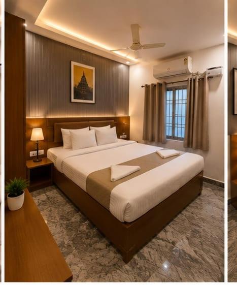 a bedroom with a large bed with two towels on it at Hotel bella rosa in Chengalpattu