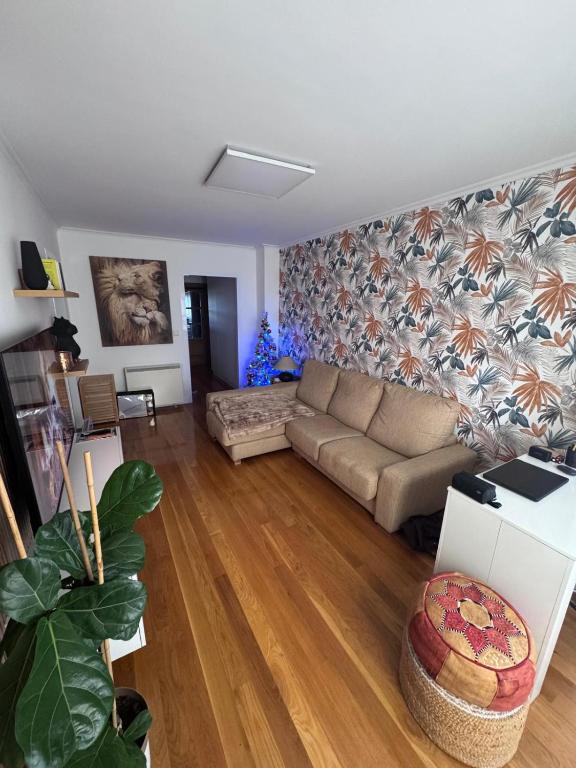 a living room with a couch and a table at Fernández Vega 6 in Ponteareas