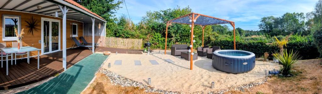 a backyard with a pool and a house at Gîte du Jarrier in Bonnefoi