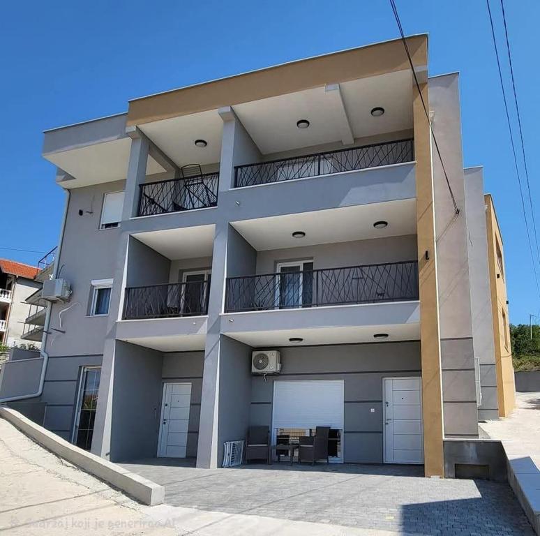 a large apartment building with two balconies at Lux apartmani boka in Tivat