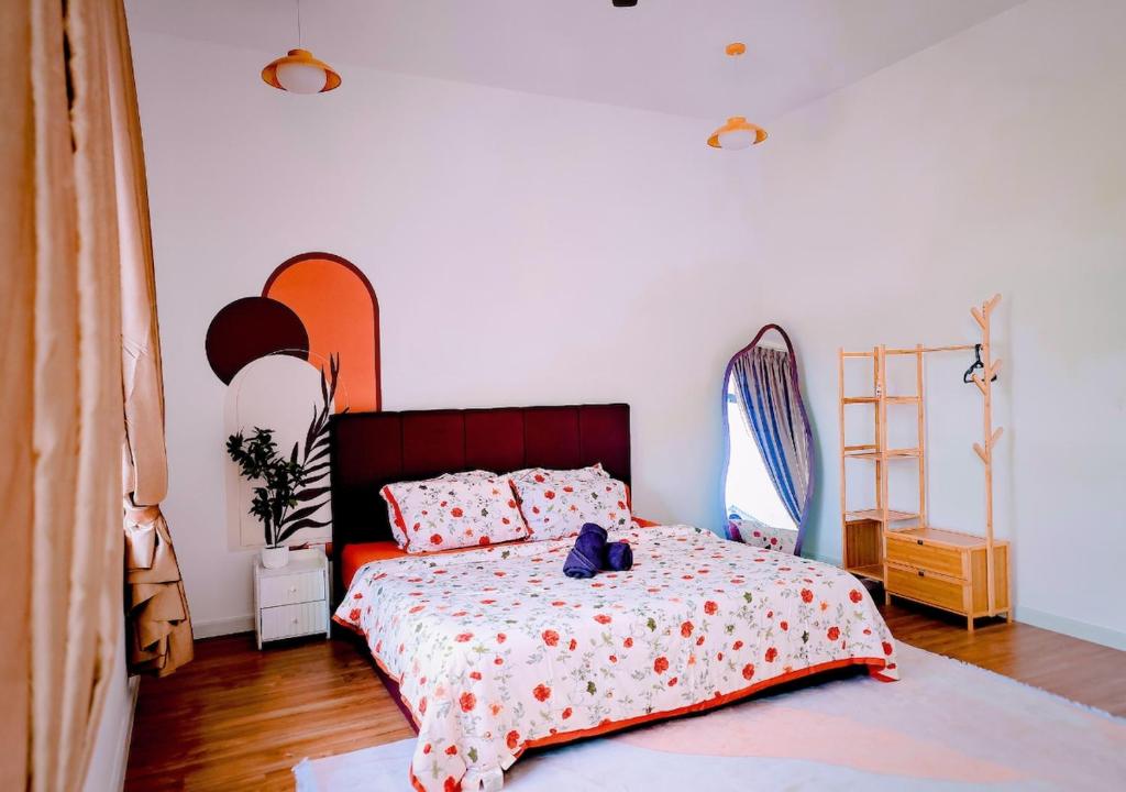 a bedroom with a bed with a red head board at Gamuda Cove 4BR SplashMania in Banting