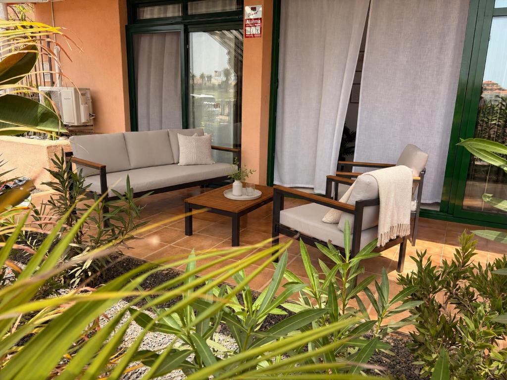 a living room with a couch and two chairs at Terrazas 532 in San Miguel de Abona