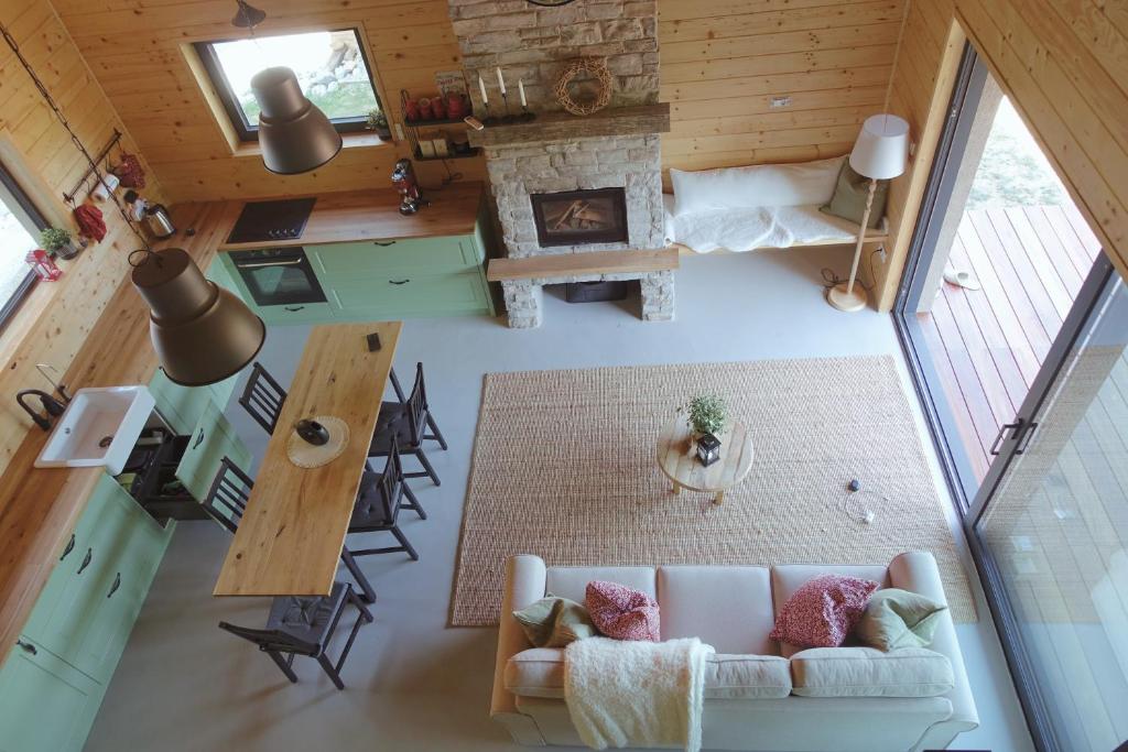 an overhead view of a living room with a couch and a fireplace at BOHO Forest Retreat in Novo Mesto