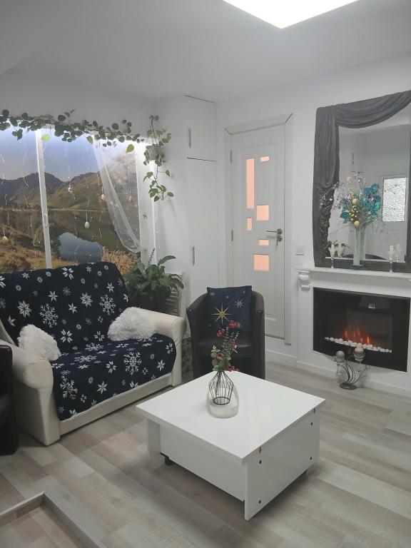 a living room with a couch and a coffee table at Duplex Marquis in Braşov