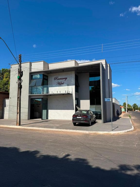 a car parked in front of a building at Rosmarry Hotel in Colinas do Tocantins