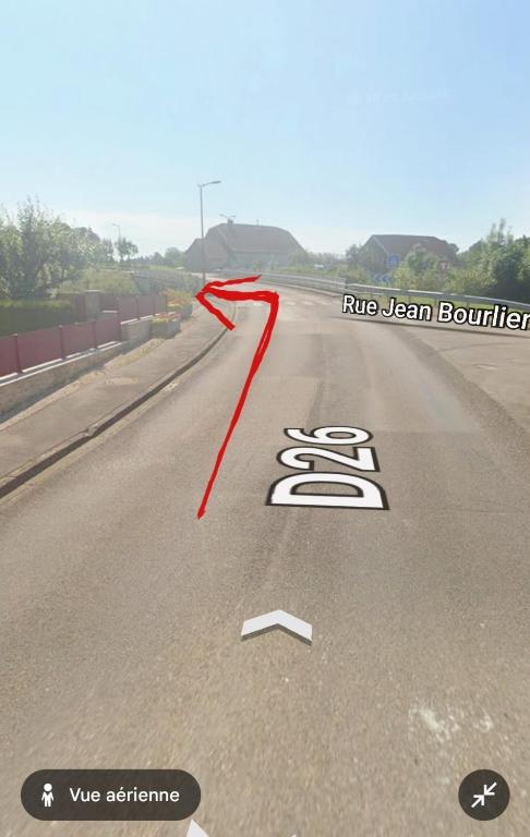 a road with a red line on the road at Gîte MARS in Torcenay