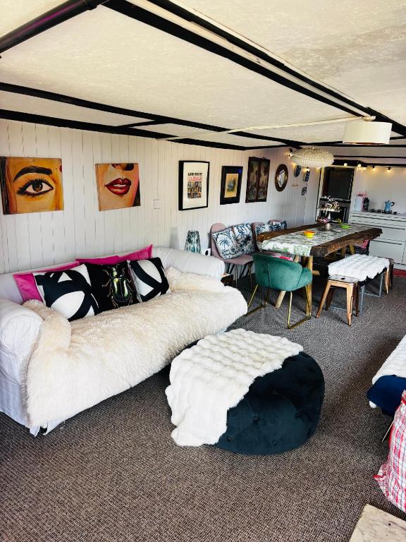 a room with two beds and a ping pong table at Farmstay cabin firepit & activities in Hertford