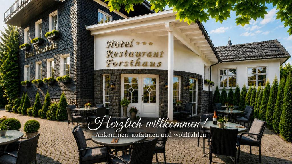 a restaurant with tables and chairs in front of a building at Hotel Forsthaus in Winterberg