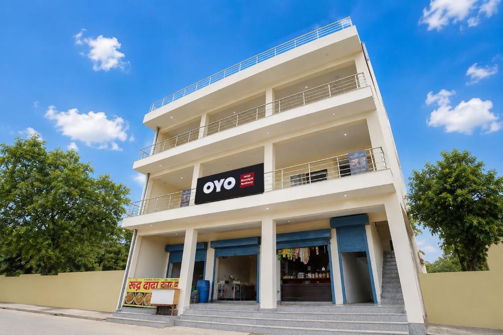 a white building with a yes sign on it at Hotel O Moonlight Residency in Noida