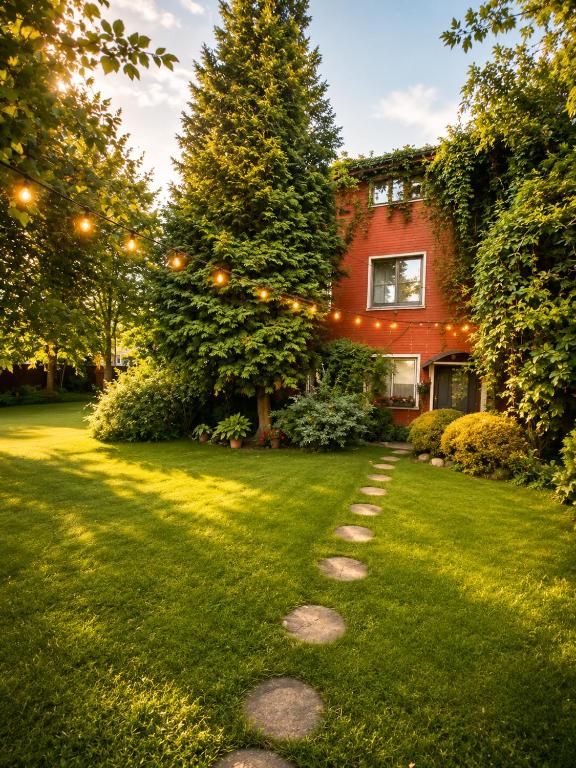 a garden with a string of lights in a yard at Private house 2km from old town in Riga