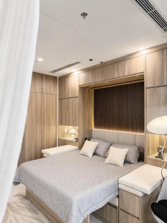 a bedroom with a large bed in a room at The Opus One 1 in Long Bình