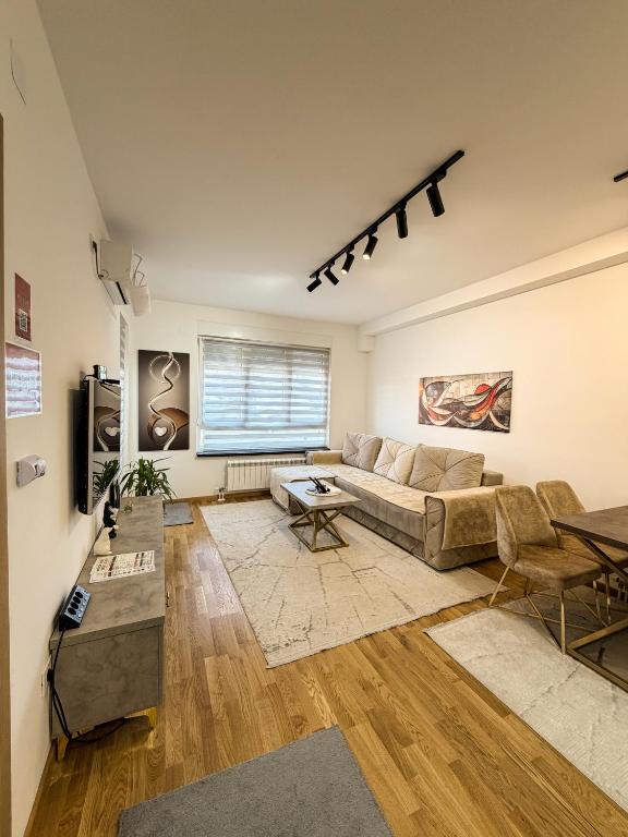 a living room with a couch and a table at Apartman Mario in Čačak