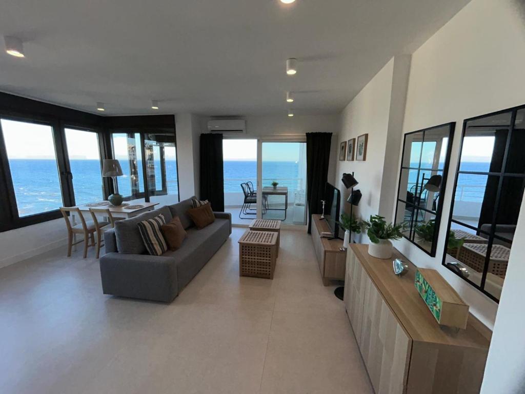 a living room with a couch and a table at Rosa de los Vientos 71 Renovado julio 2026 in Mijas Costa