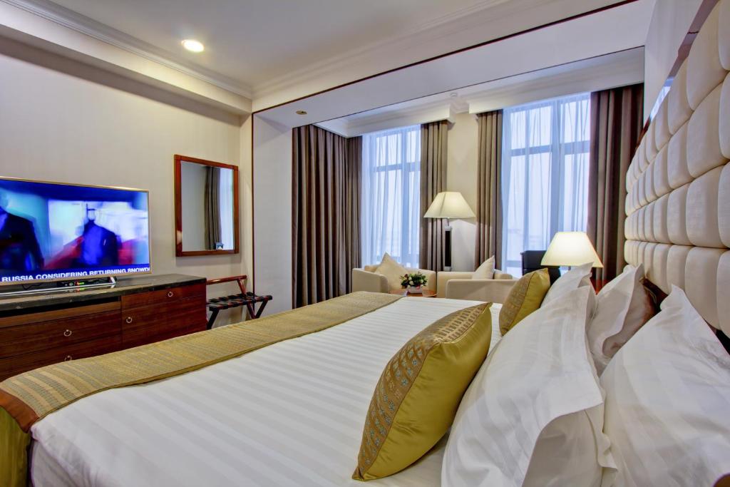 Postel nebo postele na pokoji v ubytování Hotel Lulu