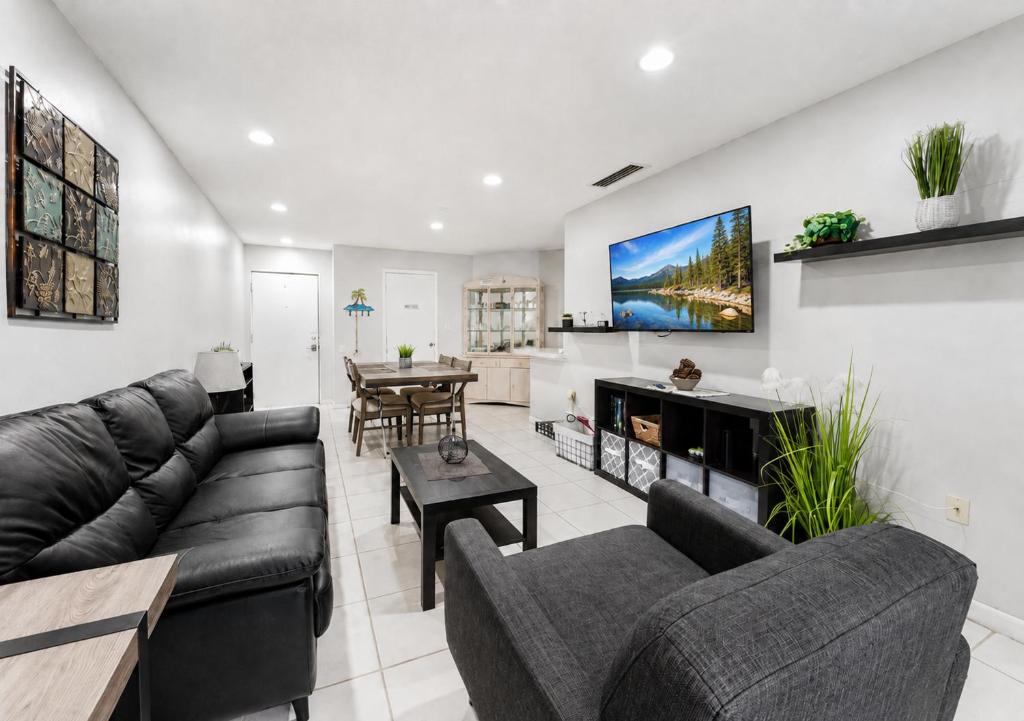 a living room with couches and a dining room at 3697 Orlando Vacational Apartment in Orlando