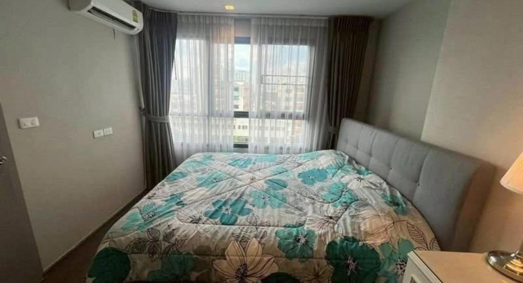 a bedroom with a bed with a quilt on it at Hotel Luxe Elite in Chhatikara