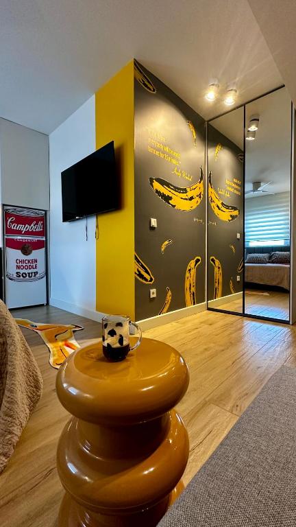 a living room with a cow sitting on a stool at Samothraki Belize Luxury Apartments in Samothraki