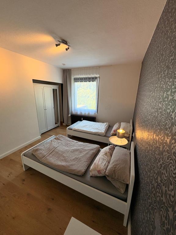 a bedroom with two beds and a window at Wohnung in herzogenrath-strass für max 4 Gäste in Herzogenrath