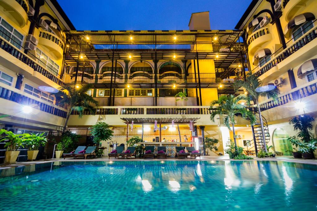 a large swimming pool in the middle of a building at Zing Resort & Spa in Pattaya South