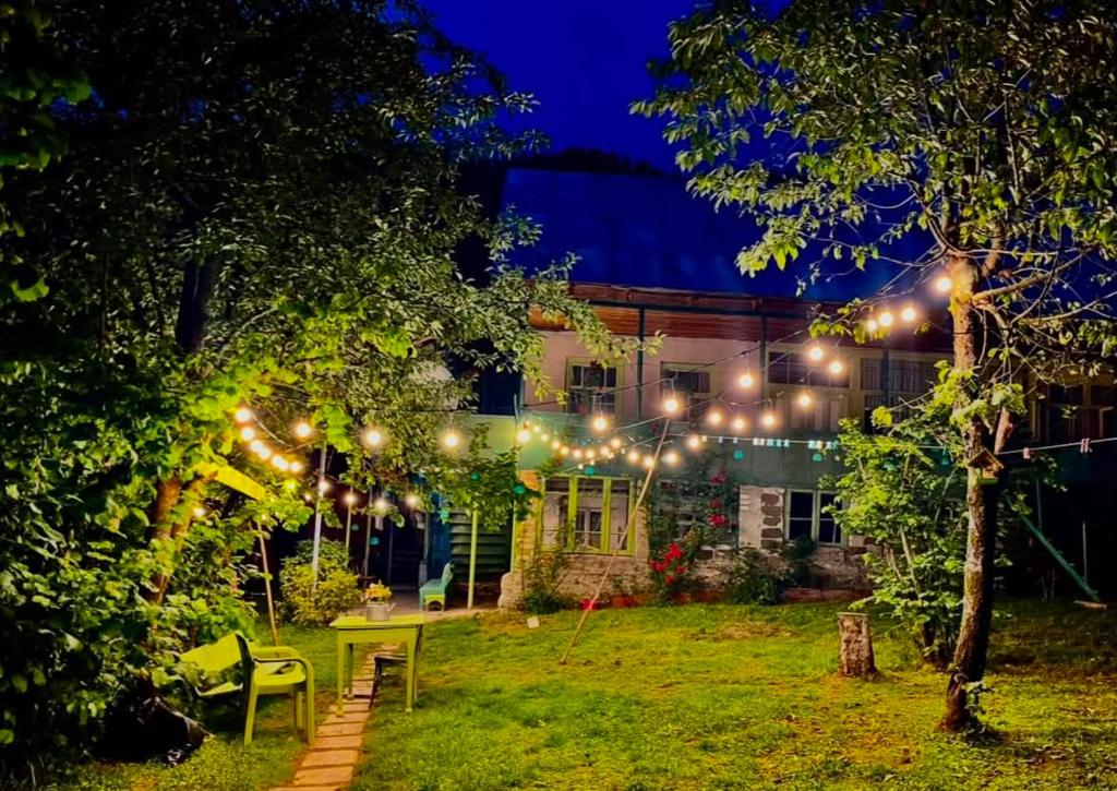a house with lights in the yard at night at Beghela in Glola