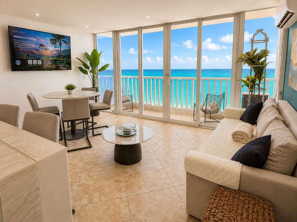 a living room with a view of the ocean at Beachfront Stella Maris Apt on Condado Ave in San Juan