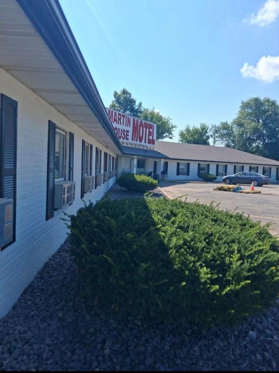 a building with a sign for a motel at Martin House Motel in Brookfield