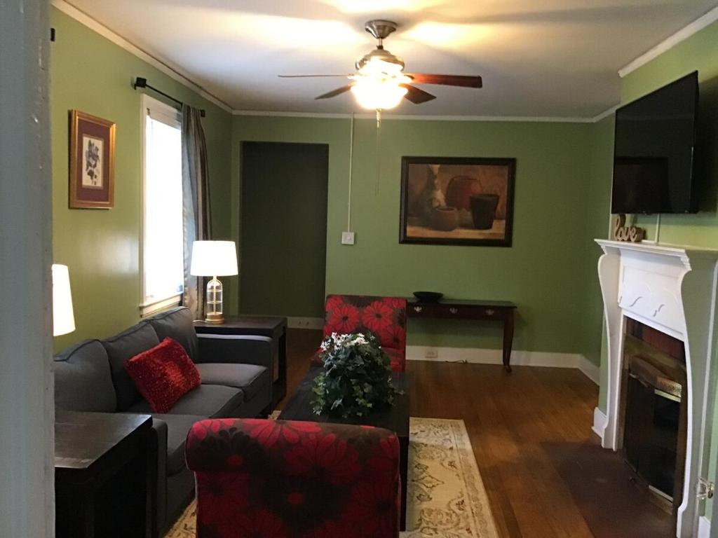 a living room with a couch and a fireplace at Cute 2 bedroom house in Augusta in Augusta