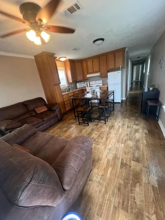 a living room with a couch and a table at Red Leaf Cottages in Lake Village