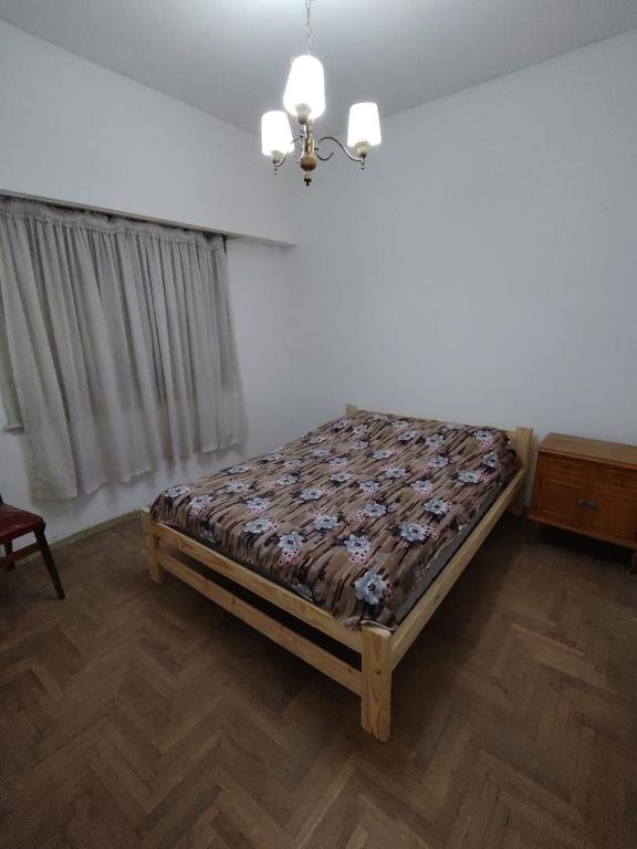 a bedroom with a bed in a room at Tucumán y Colón in Mar del Plata