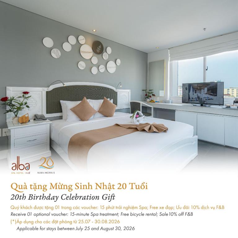 a poster of a bedroom with a bed and a tv at Alba Spa Hotel in Hue