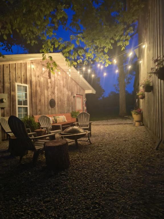 a house with a table and chairs and lights at The Little House at EVOO in Cookeville