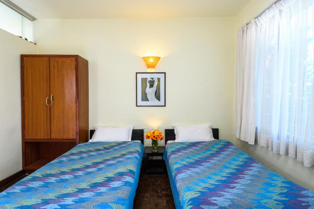 Postel nebo postele na pokoji v ubytování Dondrub Guest House