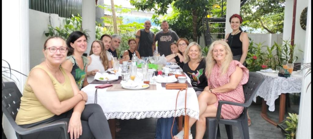 a group of people sitting at a table at Serendib Villa in Negombo