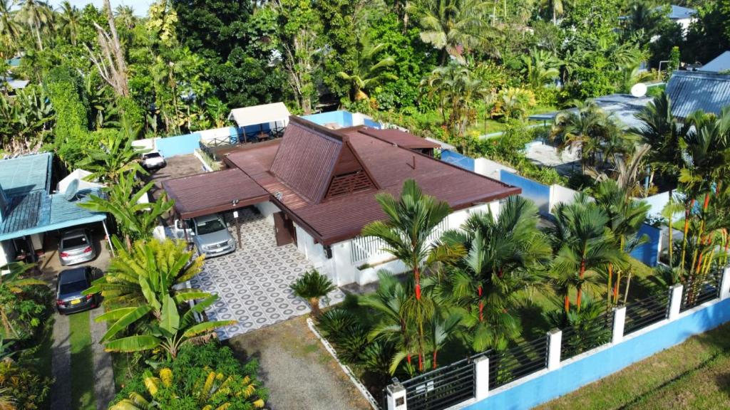 an aerial view of a house with a roof at Paradise Pacifica in Pacific Harbour