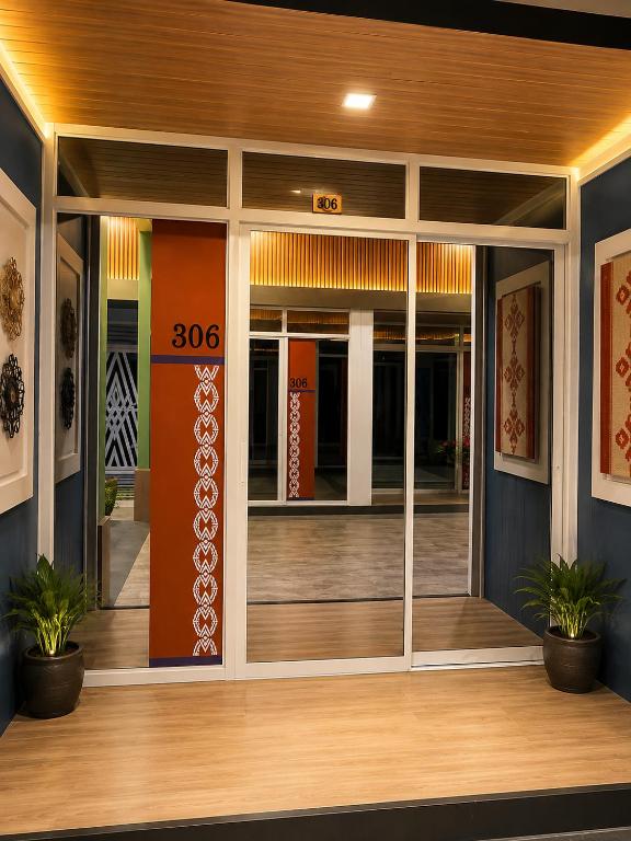 an entrance to a building with glass doors at Madigun Hotel and Events in San Francisco
