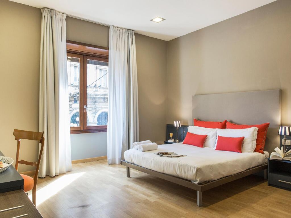 Cama o camas de una habitación en Monti First
