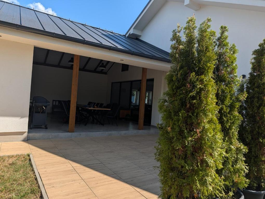 a house with a solar roof on a patio at Villa Hrachovo in Hrachovo