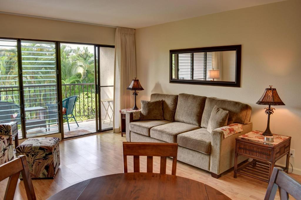 a living room with a couch and a table at Kihei Akahi C308 in Wailea