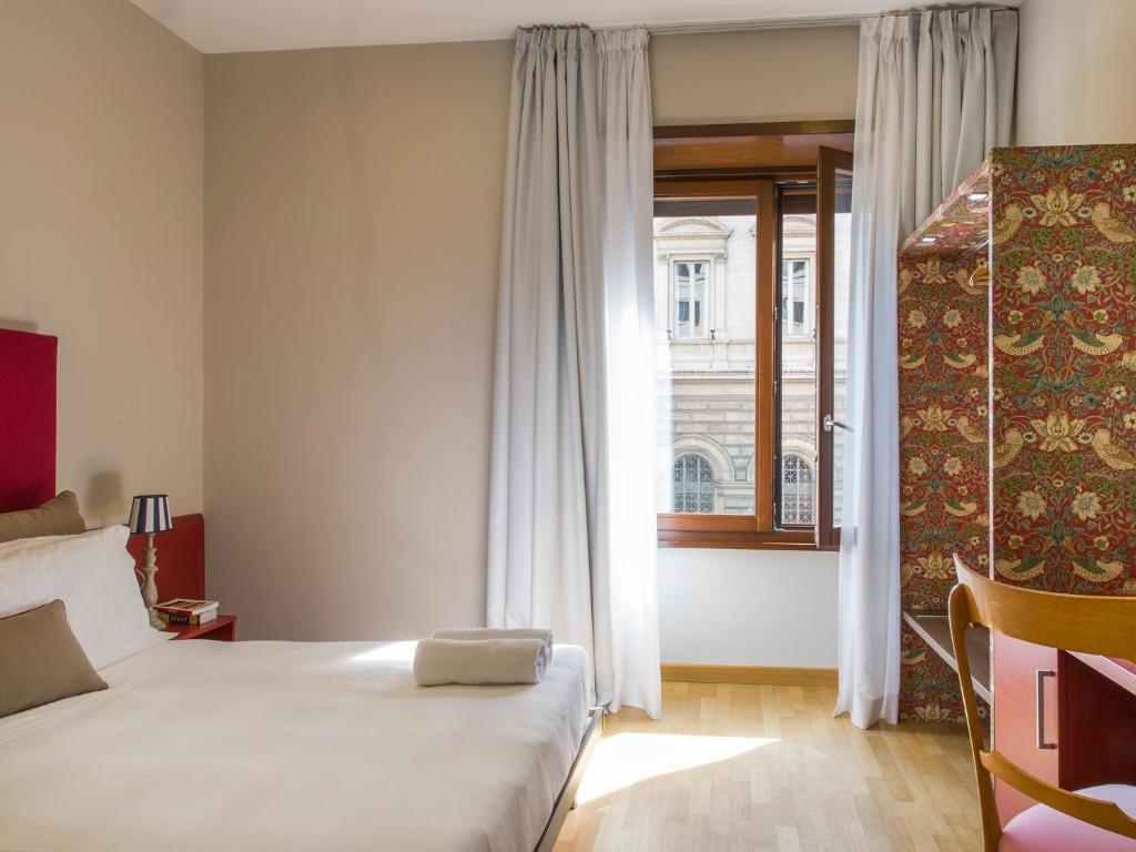 Cama o camas de una habitación en Monti First