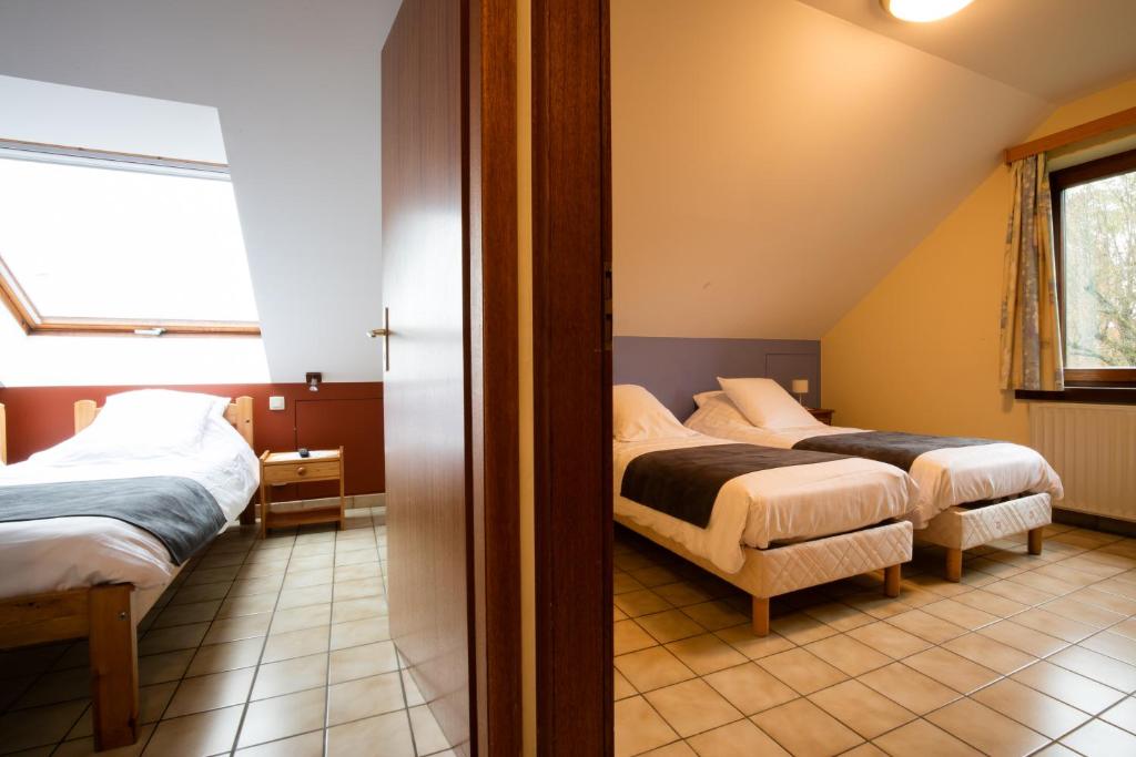 Postel nebo postele na pokoji v ubytování Hotel Beau Site